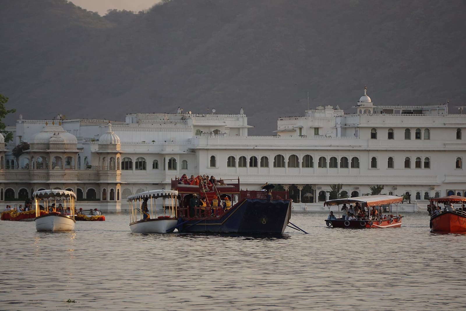 A lakeside palace courtyard in Udaipur set for an evening function.